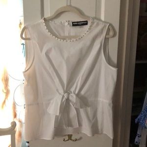 Classic white sleeveless wrap tie cotton blouse.